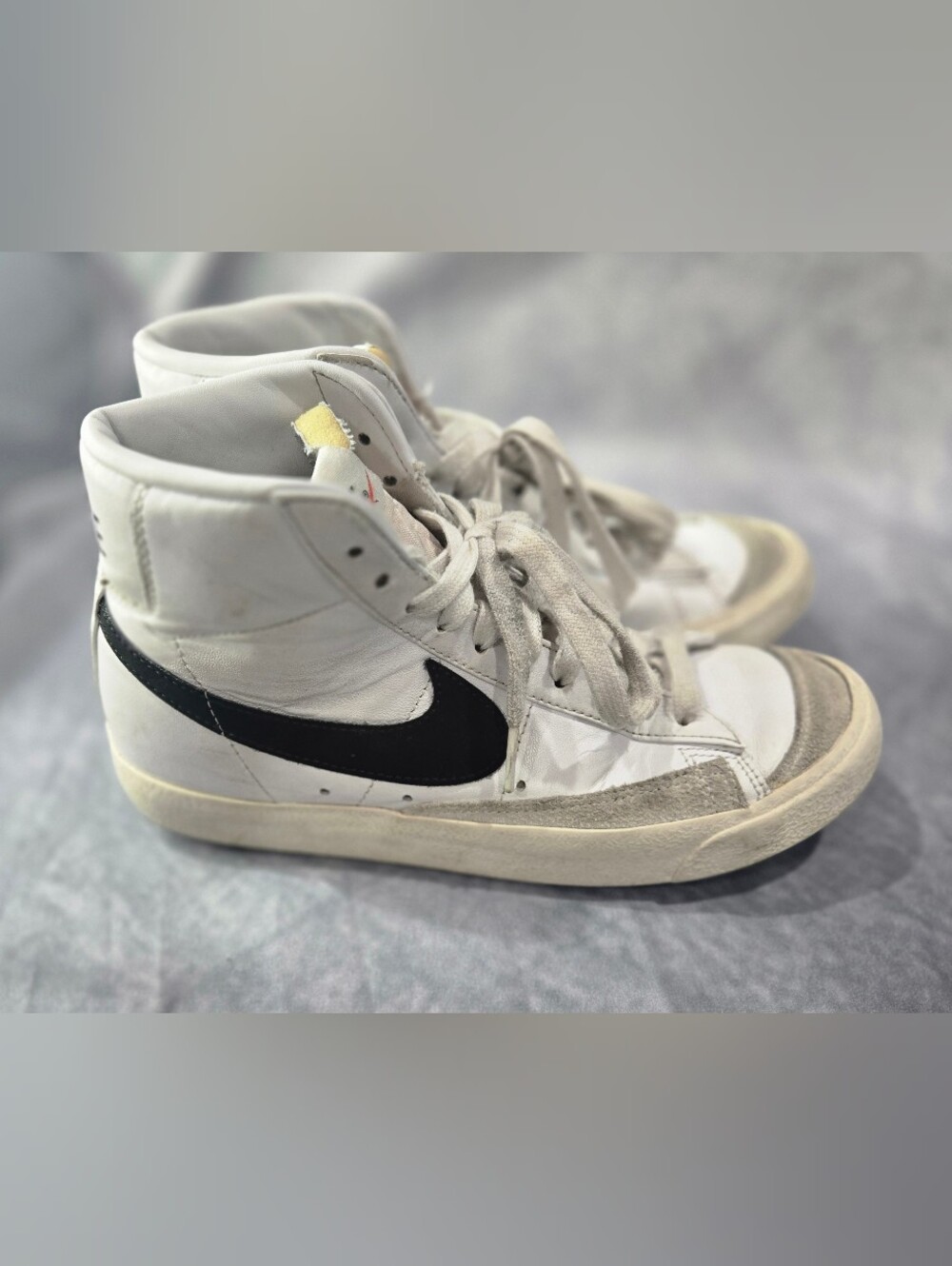 Nike White High-Top Sneakers with Black Swoosh